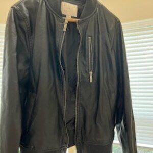 Brown lined leather coat with zippered pocket.